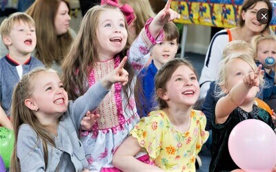 children at kids party venue in Northamptonshire watching the magic show